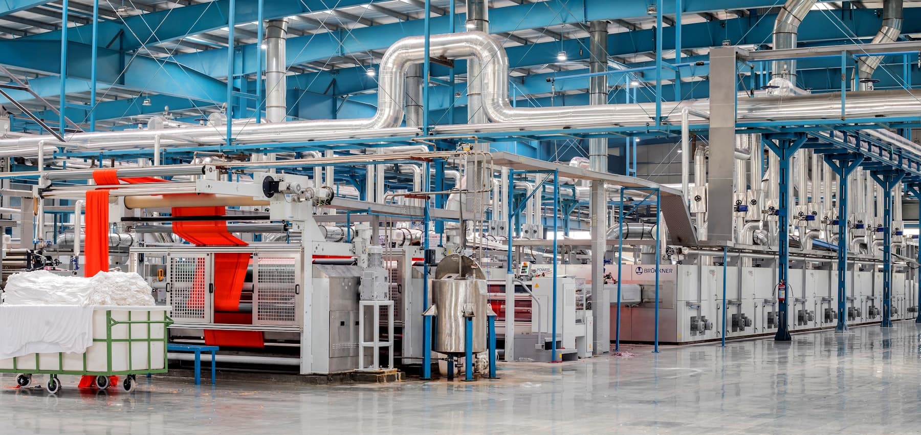 Fabric running through a stenter on a textile finishing line